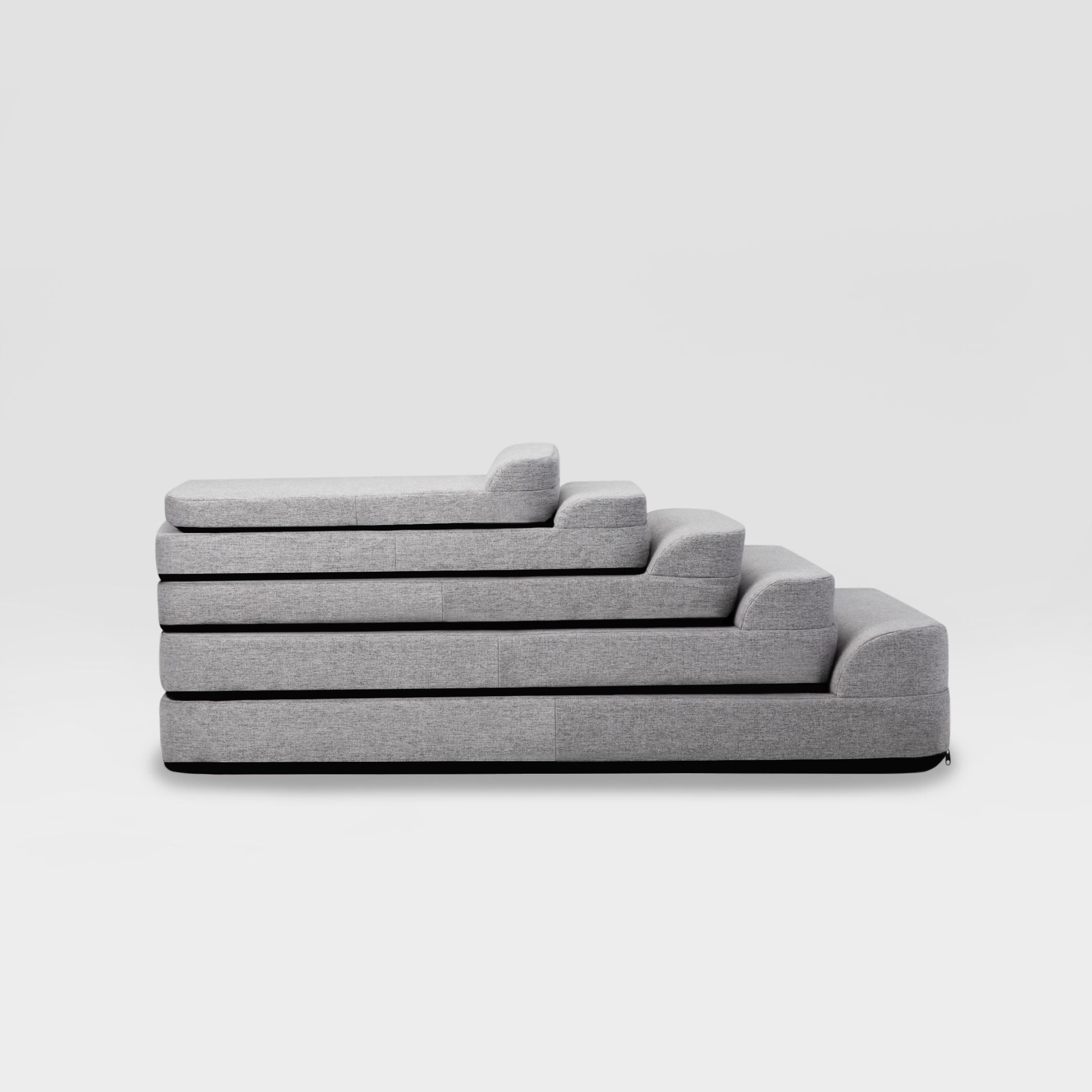 a set of five Bolstr beds descending in size stacked on top of each other