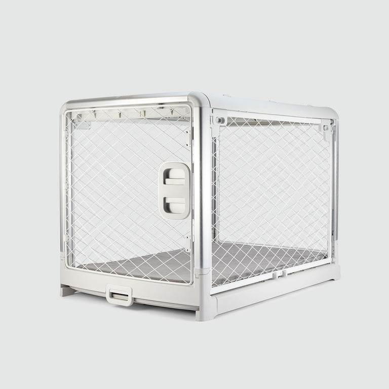 An Ash White Revol Dog Crate pictured diagonally from the front on an offwhite background
